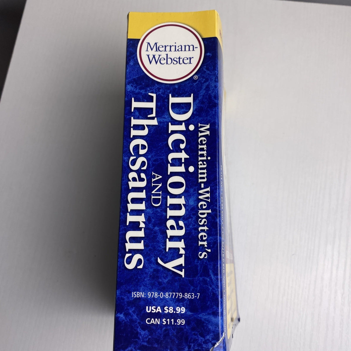 Merriam-Webster's Dictionary and Thesaurus 2014 revised edition paperback book front cover