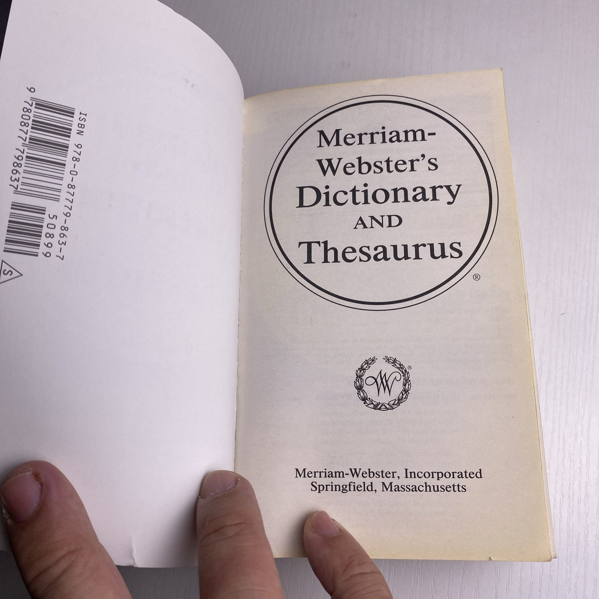 Merriam-Webster's Dictionary and Thesaurus 2014 revised edition paperback book front cover
