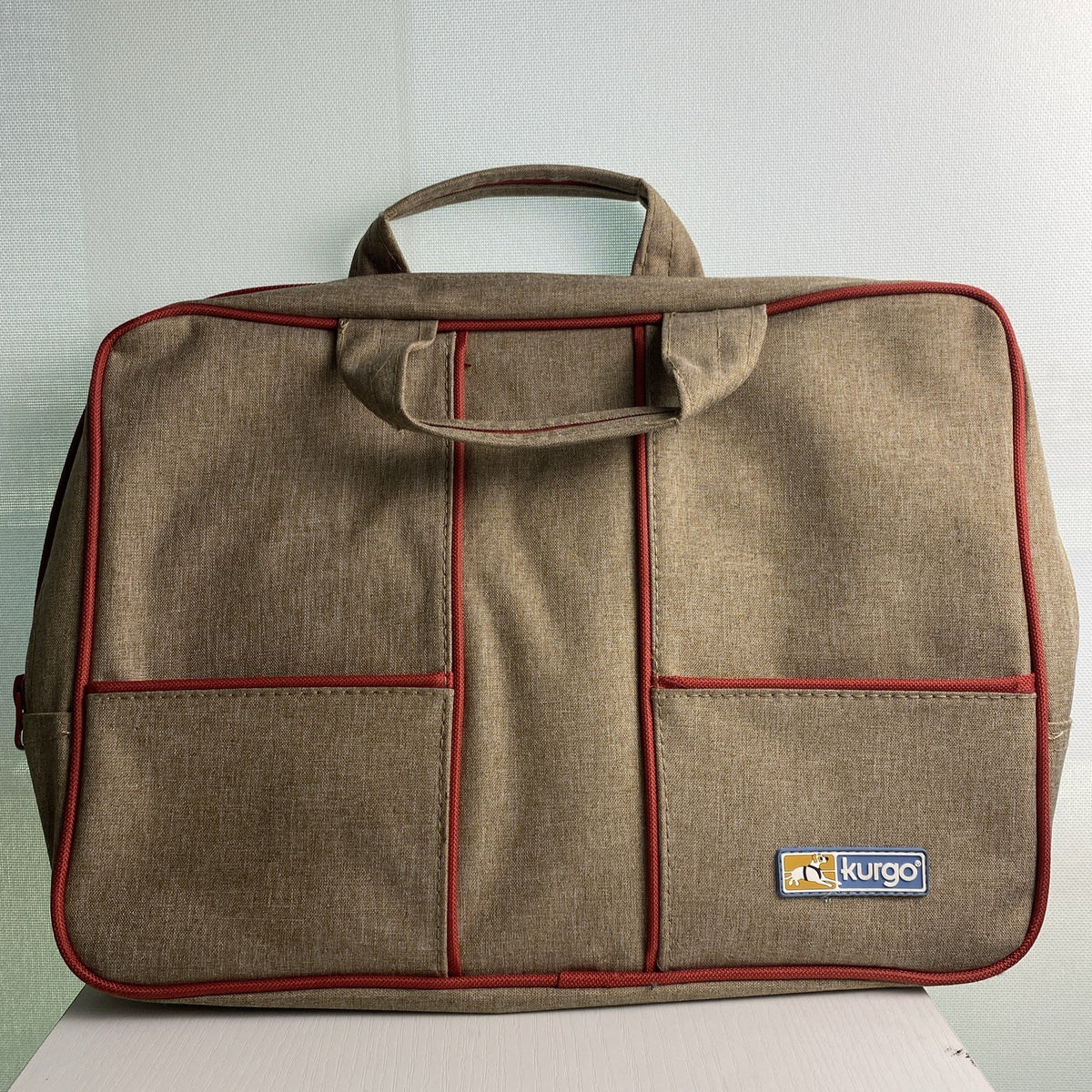 Kurgo pet travel gear organizer tote bag in heathered brown with red piping and dual handles