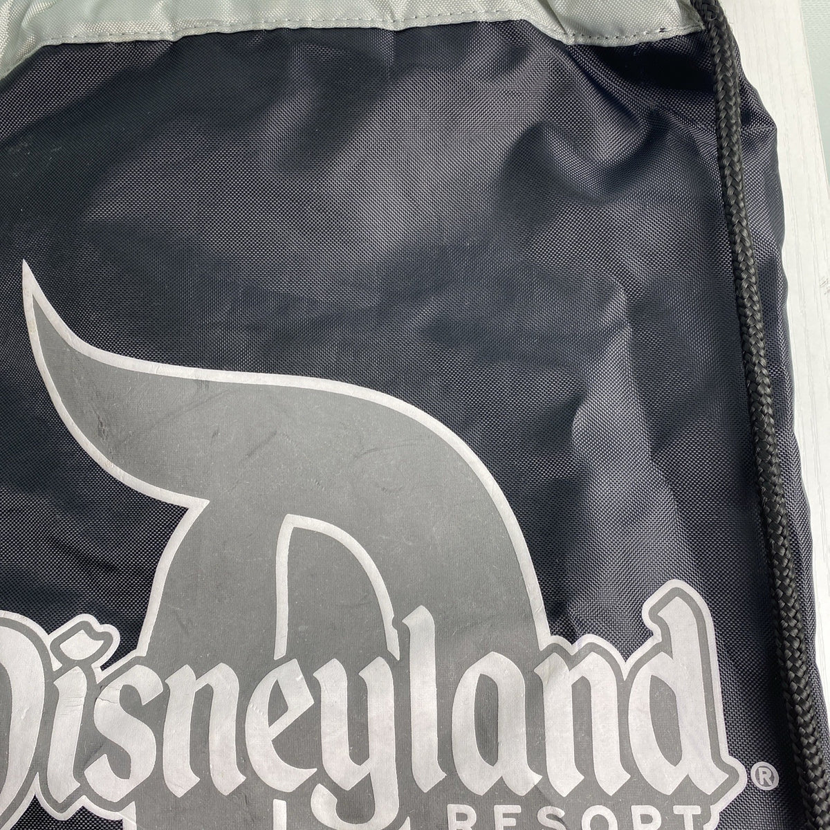 Disney Disneyland Resort 60th Diamond Celebration Annual Passholder black drawstring backpack with red piping