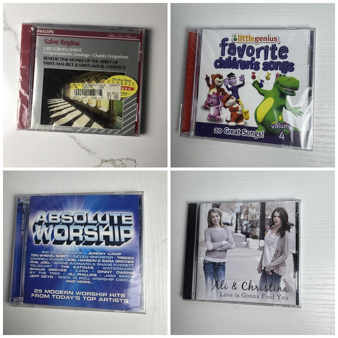 Set of 4 factory-sealed CDs including Salve Regina Gregorian Chant, Absolute Worship, and Little Genius children's songs.