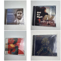 Set of four factory-sealed music CDs featuring classical, Latin pop, neo-soul, and sacred vocal albums.