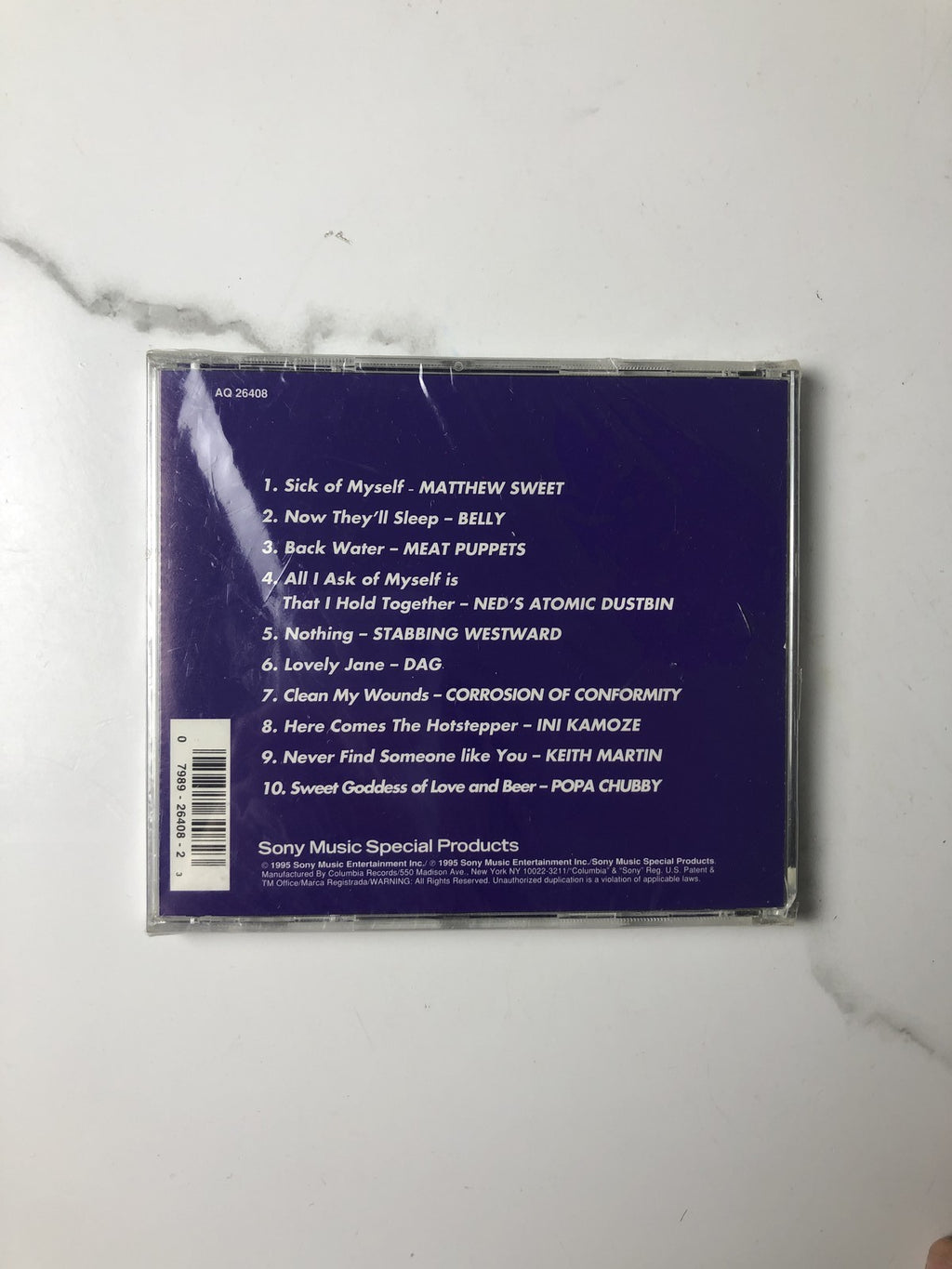 Assorted lot of 4 brand new factory-sealed music CDs including Sound of Music London Cast and 90s Sony Rock Sampler