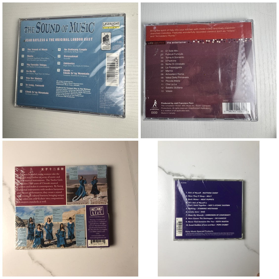 Assorted lot of 4 brand new factory-sealed music CDs including Sound of Music London Cast and 90s Sony Rock Sampler