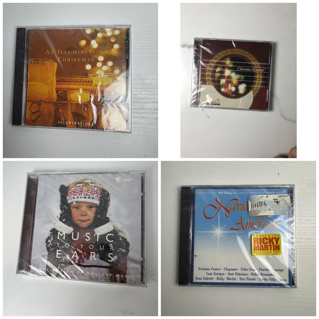 Lot of 4 factory sealed Christmas music CDs including Latin, acoustic, and classical holiday albums.