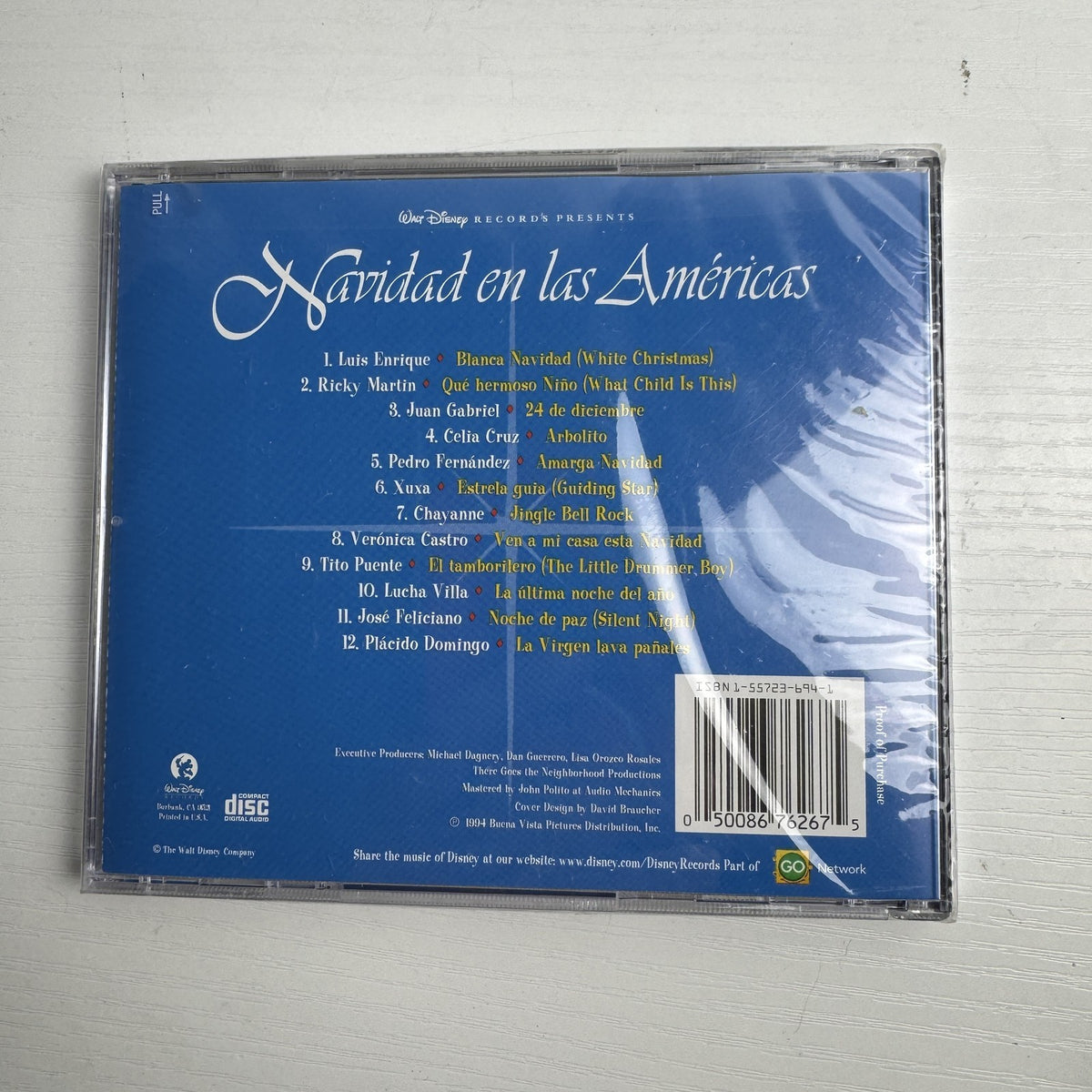 Lot of 4 factory sealed Christmas music CDs including Latin, acoustic, and classical holiday albums.