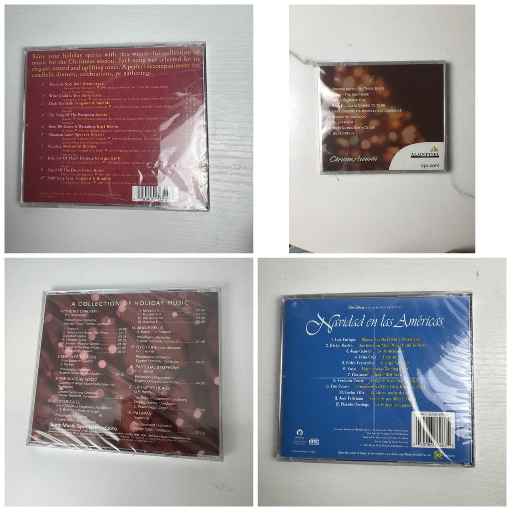Lot of 4 factory sealed Christmas music CDs including Latin, acoustic, and classical holiday albums.