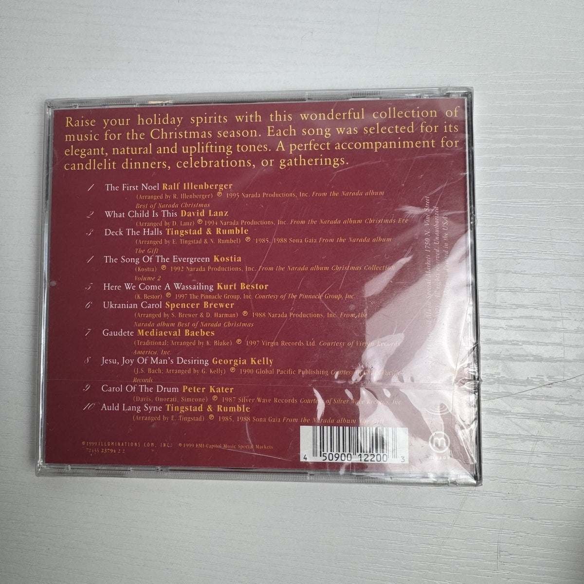 Lot of 4 factory sealed Christmas music CDs including Latin, acoustic, and classical holiday albums.