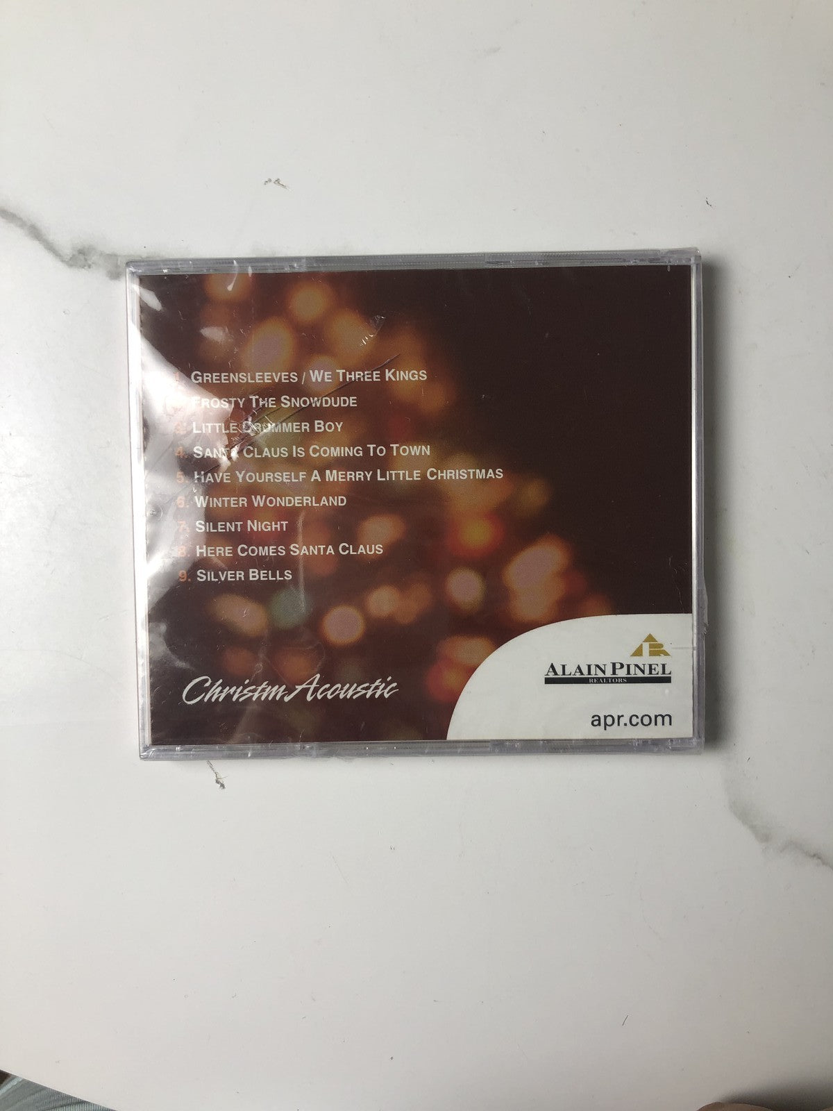 Lot of 4 factory sealed Christmas music CDs including Latin, acoustic, and classical holiday albums.
