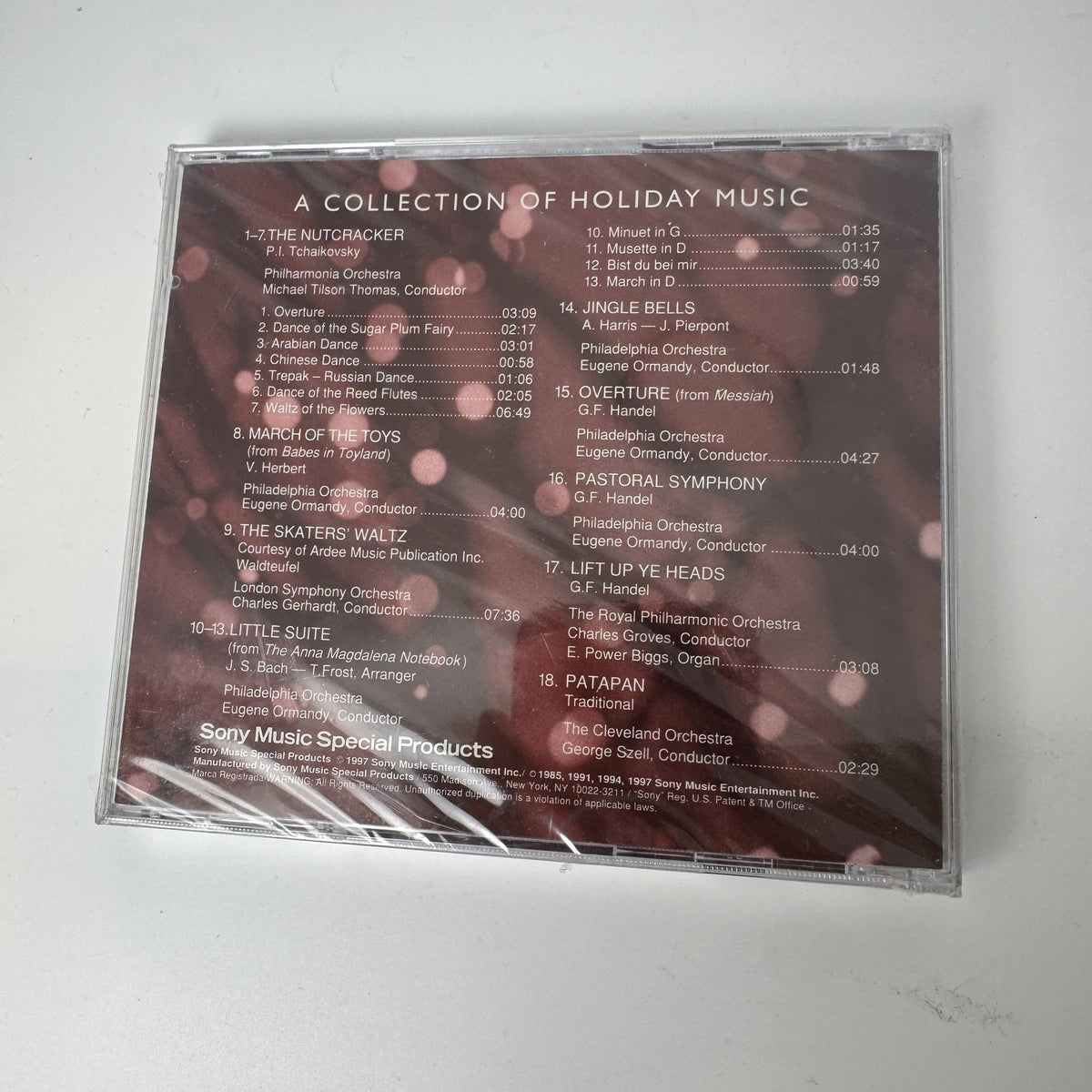 Lot of 4 factory sealed Christmas music CDs including Latin, acoustic, and classical holiday albums.