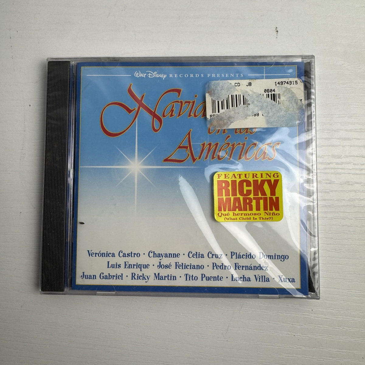 Lot of 4 factory sealed Christmas music CDs including Latin, acoustic, and classical holiday albums.