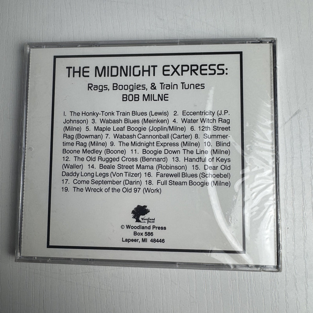 Set of 4 factory-sealed classical and piano music CDs including Andrew Lloyd Webber and Bob Milne albums.