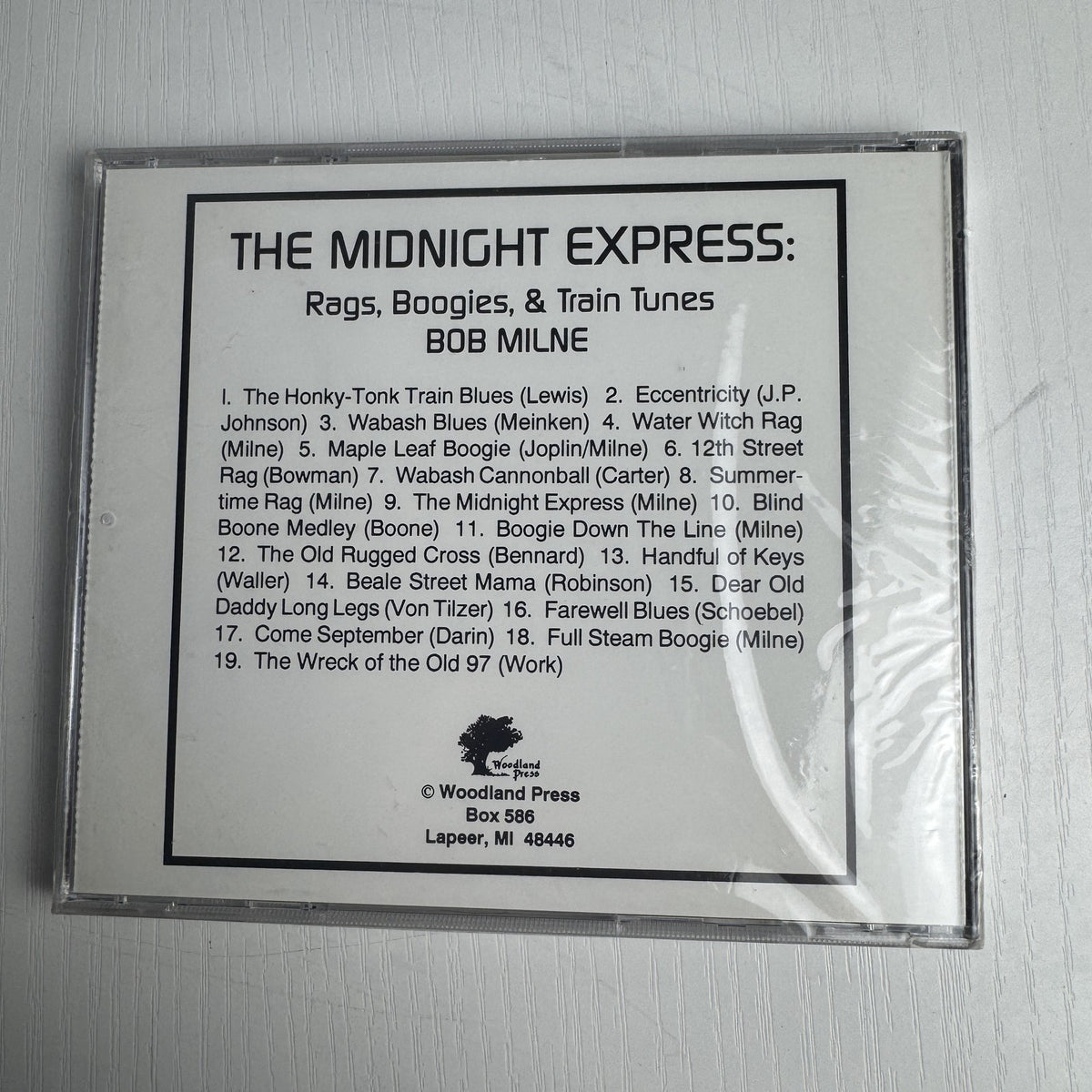 Set of 4 factory-sealed classical and piano music CDs including Andrew Lloyd Webber and Bob Milne albums.