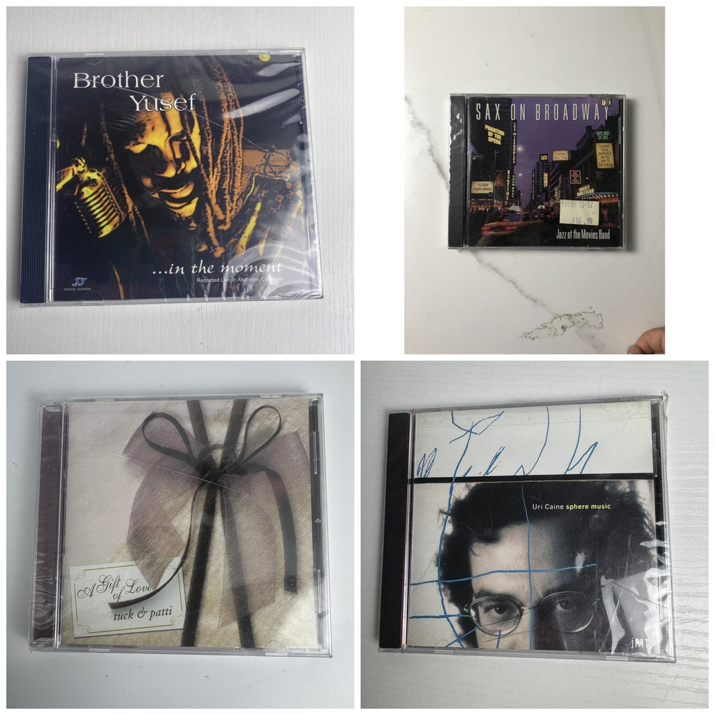 Lot of 4 brand new jazz music CDs including albums by Uri Caine, Tuck and Patti, Brother Yusef, and Jazz at the Movies Band.
