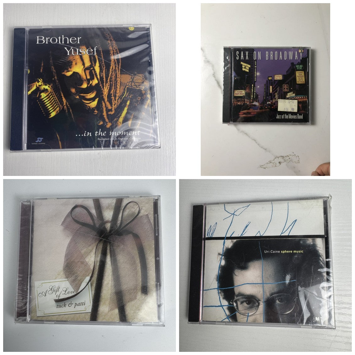 Lot of 4 brand new jazz music CDs including albums by Uri Caine, Tuck and Patti, Brother Yusef, and Jazz at the Movies Band.