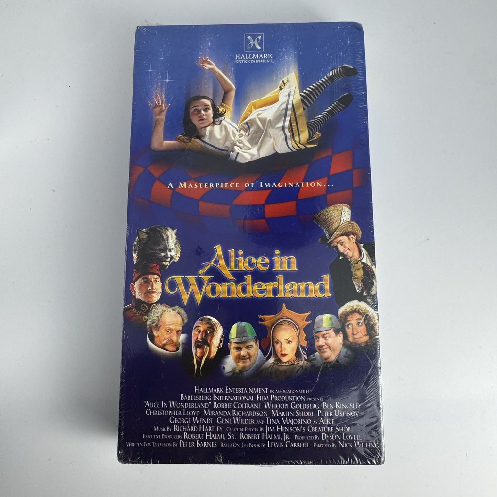 Lot of four brand-new factory-sealed vintage family VHS tapes including Alice in Wonderland and The Egg and I.