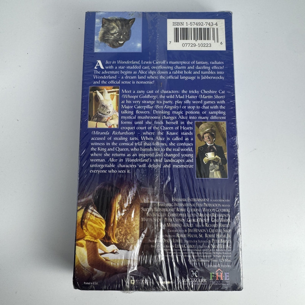 Lot of four brand-new factory-sealed vintage family VHS tapes including Alice in Wonderland and The Egg and I.