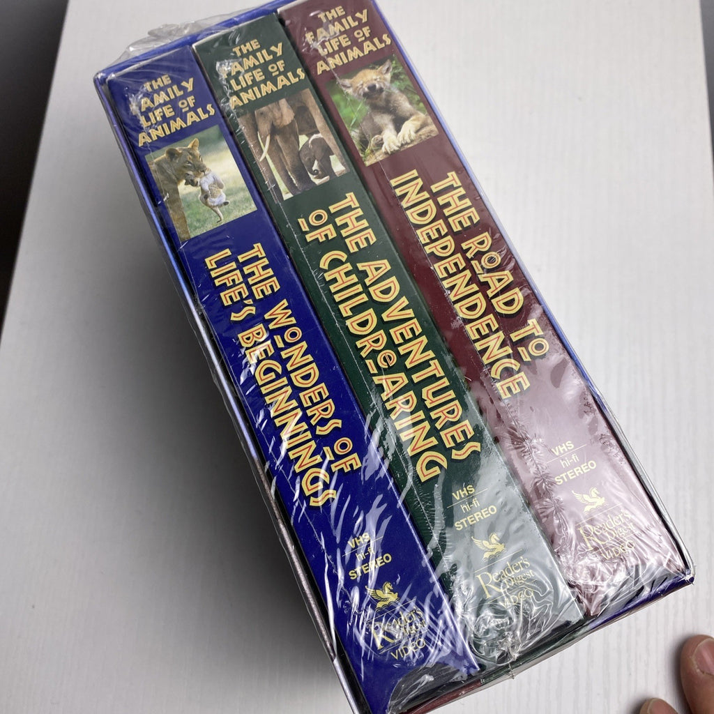 Lot of four brand-new factory-sealed vintage family VHS tapes including Alice in Wonderland and The Egg and I.