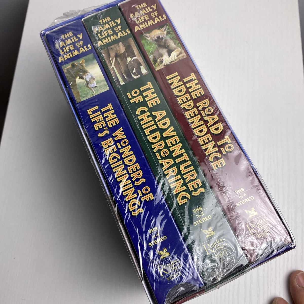 Lot of four brand-new factory-sealed vintage family VHS tapes including Alice in Wonderland and The Egg and I.