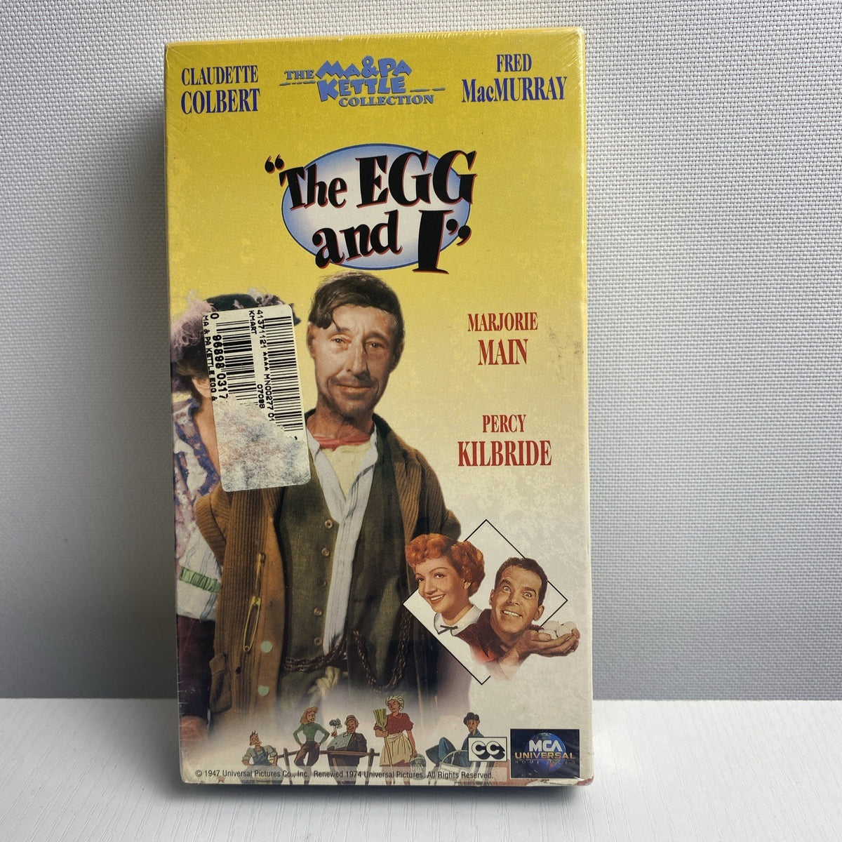 Lot of four brand-new factory-sealed vintage family VHS tapes including Alice in Wonderland and The Egg and I.