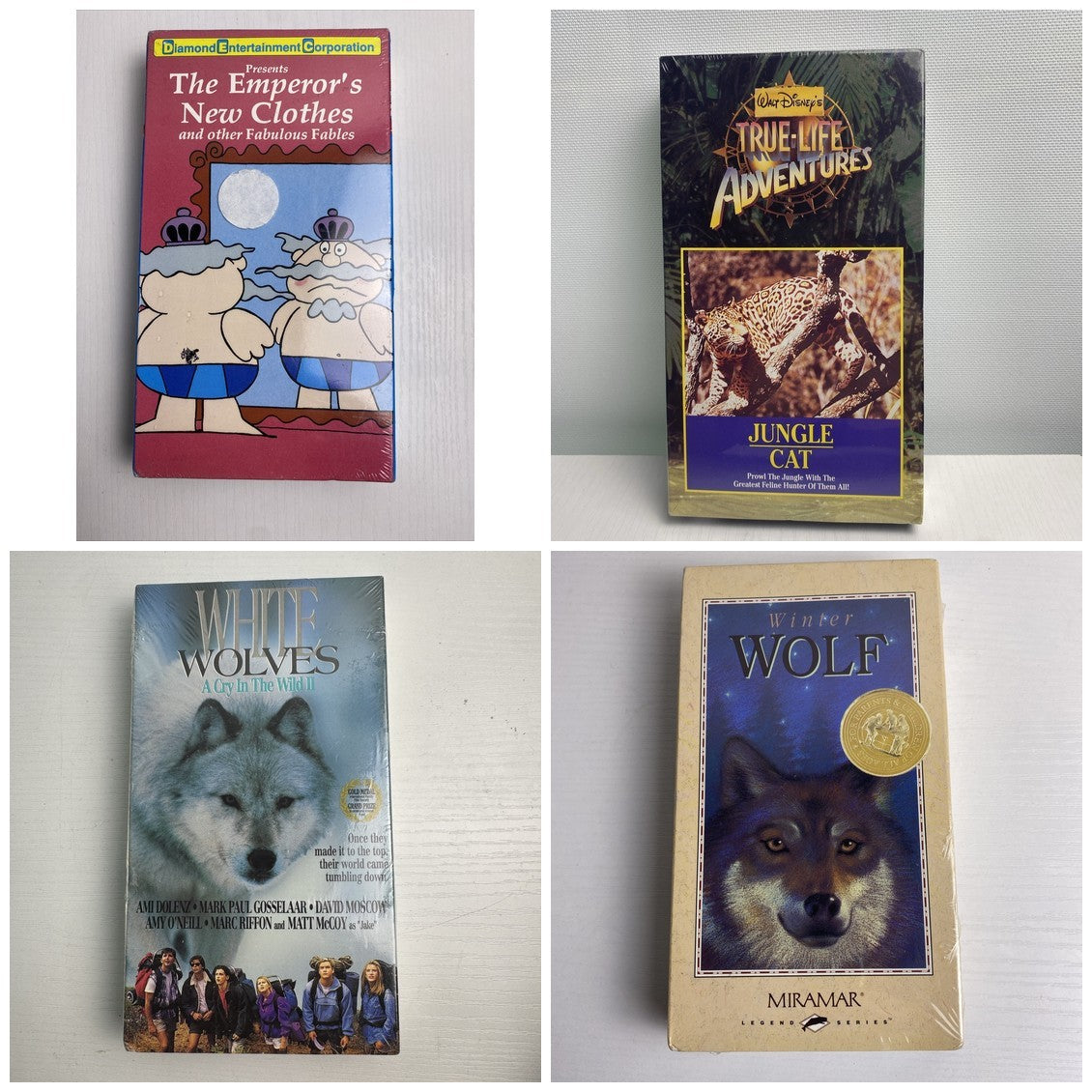 Lot of 4 factory-sealed family VHS movie tapes featuring Disney's Jungle Cat and 90s adventure White Wolves