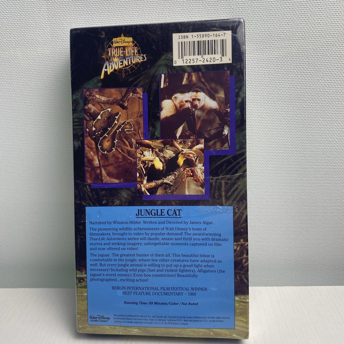Lot of 4 factory-sealed family VHS movie tapes featuring Disney's Jungle Cat and 90s adventure White Wolves