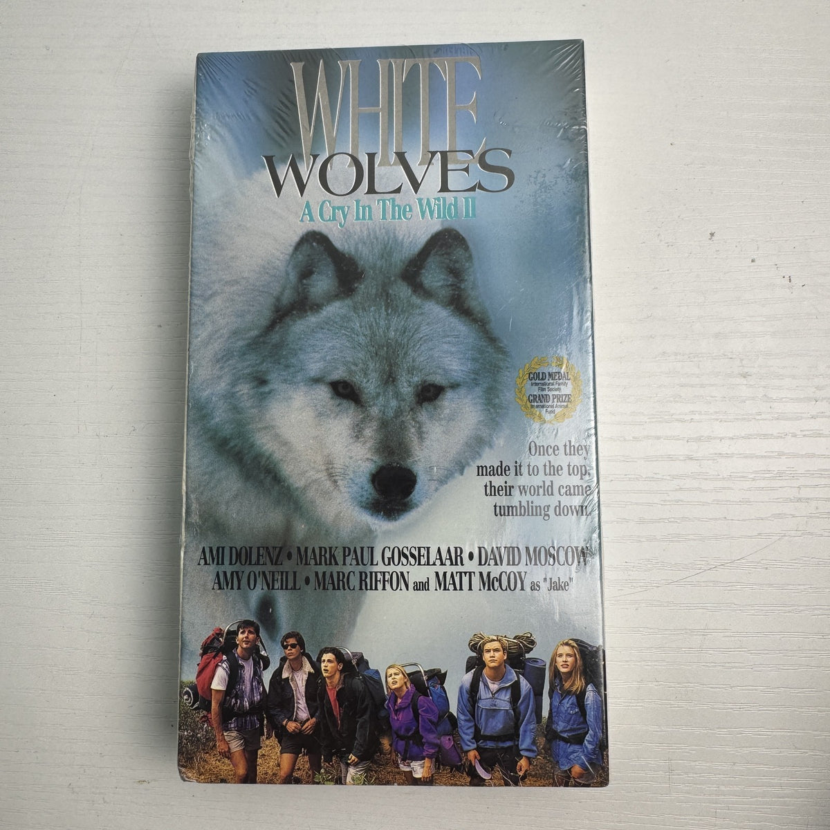 Lot of 4 factory-sealed family VHS movie tapes featuring Disney's Jungle Cat and 90s adventure White Wolves