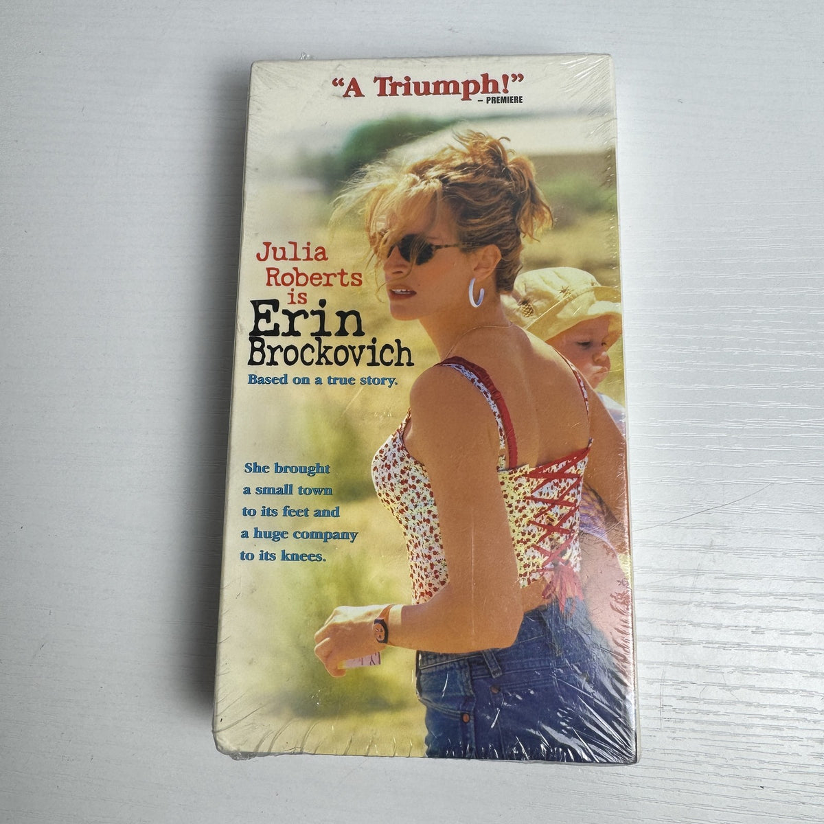 Factory-sealed lot of 4 VHS tapes including Erin Brockovich, Evita, Fish Hawk, and Frank Patterson.