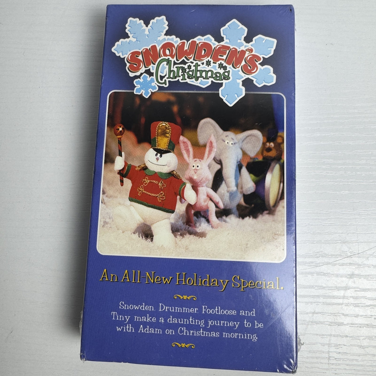 Lot of 3 factory-sealed VHS tapes including Working Girl, Snowden's Christmas, and Rudolph Frosty Sing Along