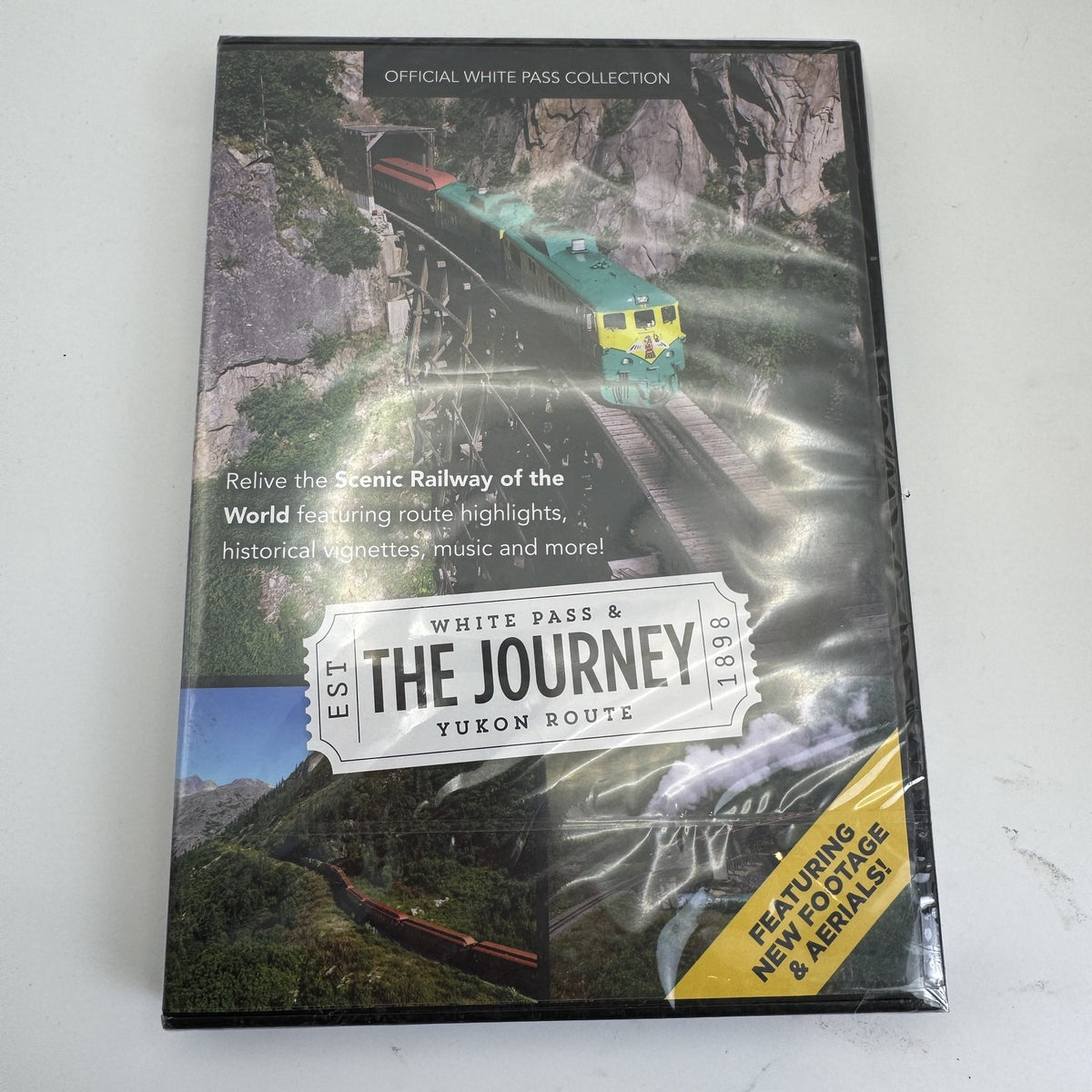 Set of four factory-sealed DVDs including White Pass Yukon Route documentaries and Jillian Michaels fitness workouts.