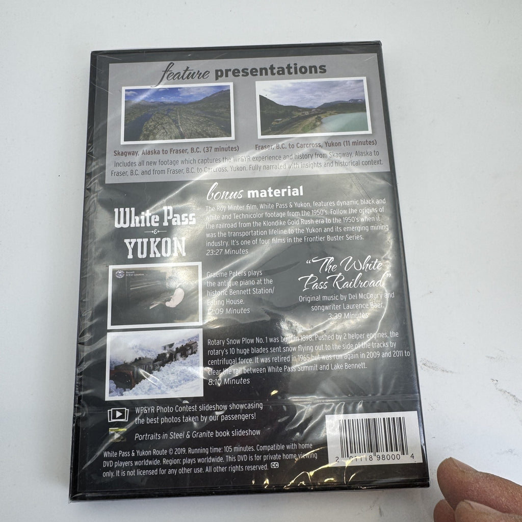 Set of four factory-sealed DVDs including White Pass Yukon Route documentaries and Jillian Michaels fitness workouts.