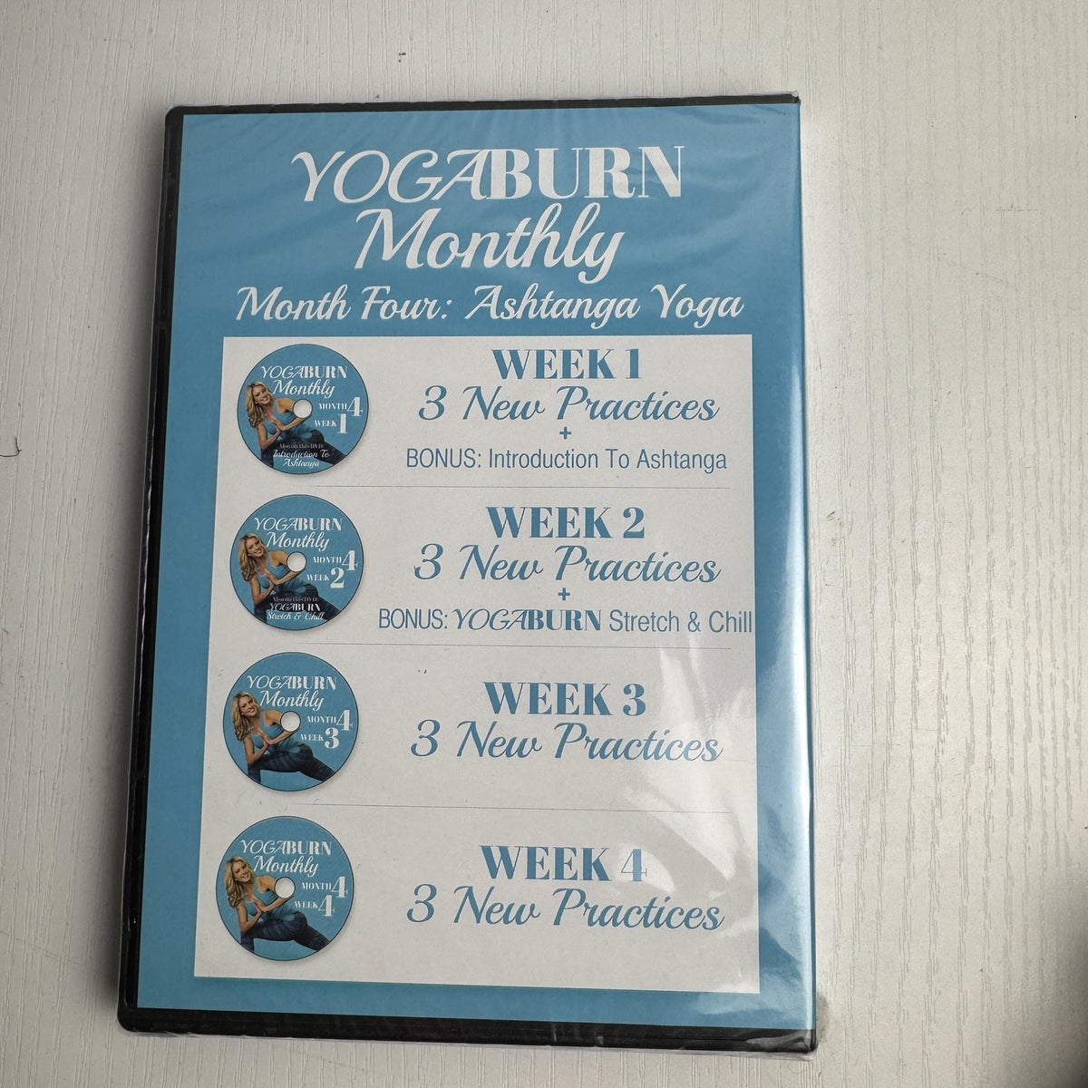 Set of four factory-sealed Yoga Burn Monthly and NOOMA Breathe home fitness DVDs