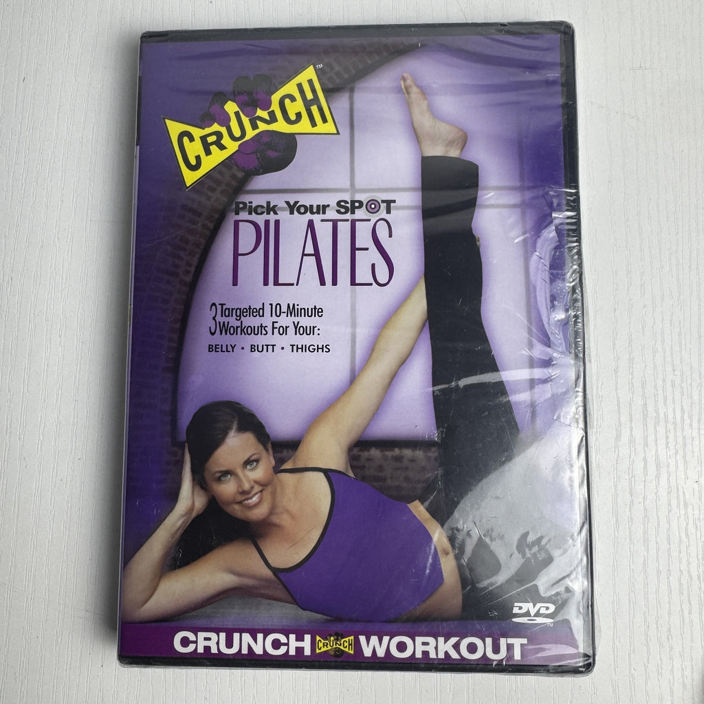 Factory-sealed retro fitness and wellness media lot featuring four DVD and VHS titles including Crunch and The Firm.