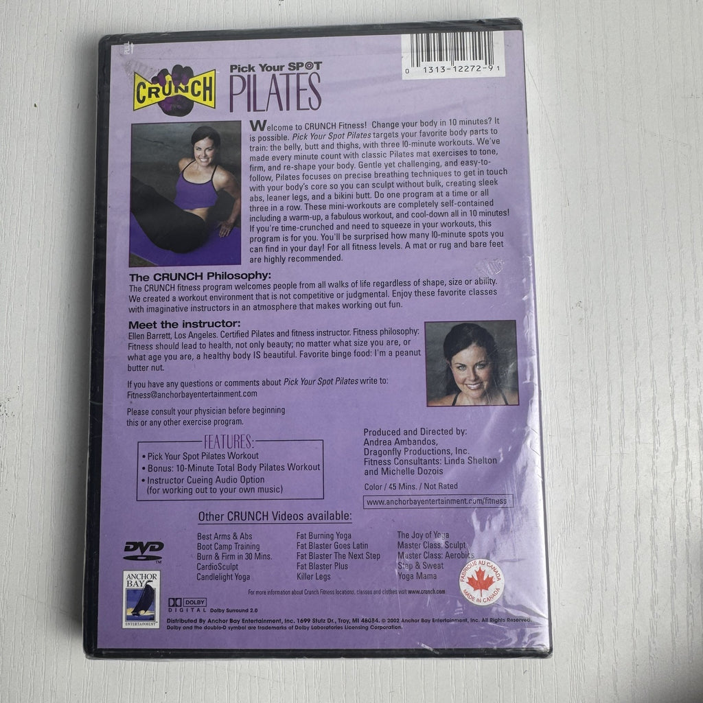 Factory-sealed retro fitness and wellness media lot featuring four DVD and VHS titles including Crunch and The Firm.