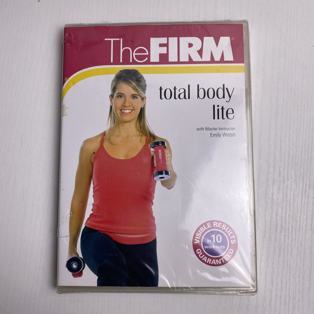 Factory-sealed retro fitness and wellness media lot featuring four DVD and VHS titles including Crunch and The Firm.