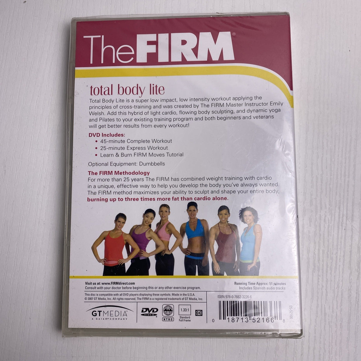 Factory-sealed retro fitness and wellness media lot featuring four DVD and VHS titles including Crunch and The Firm.