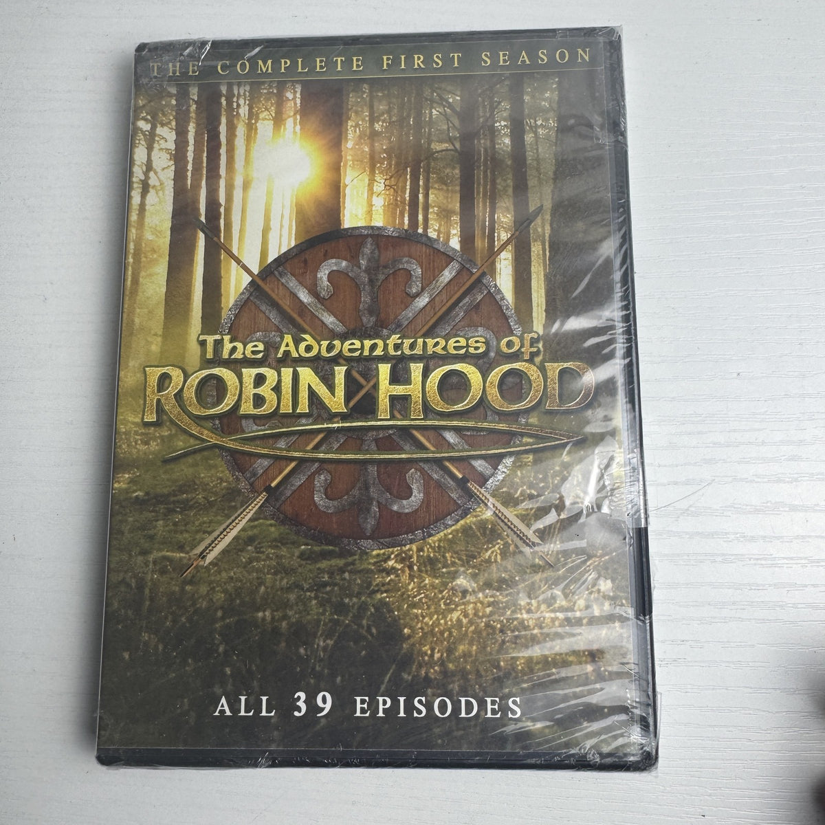 Four factory sealed classic TV show DVD box sets including Robin Hood, Johnny Carson, The Lucy Show, and The Tudors.