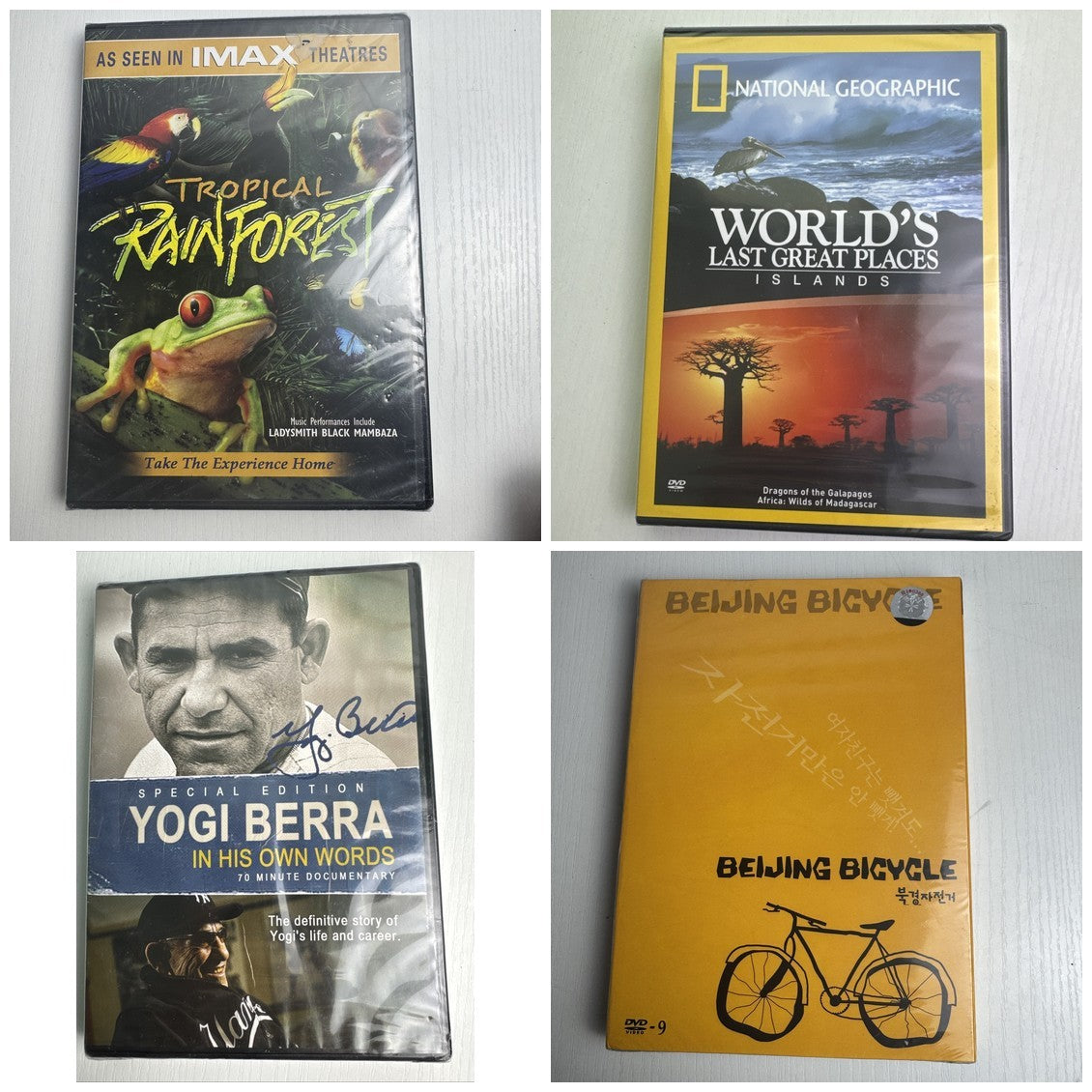 Brand new sealed 4-DVD lot including IMAX Tropical Rainforest, Nat Geo Islands, Yogi Berra, and Beijing Bicycle.