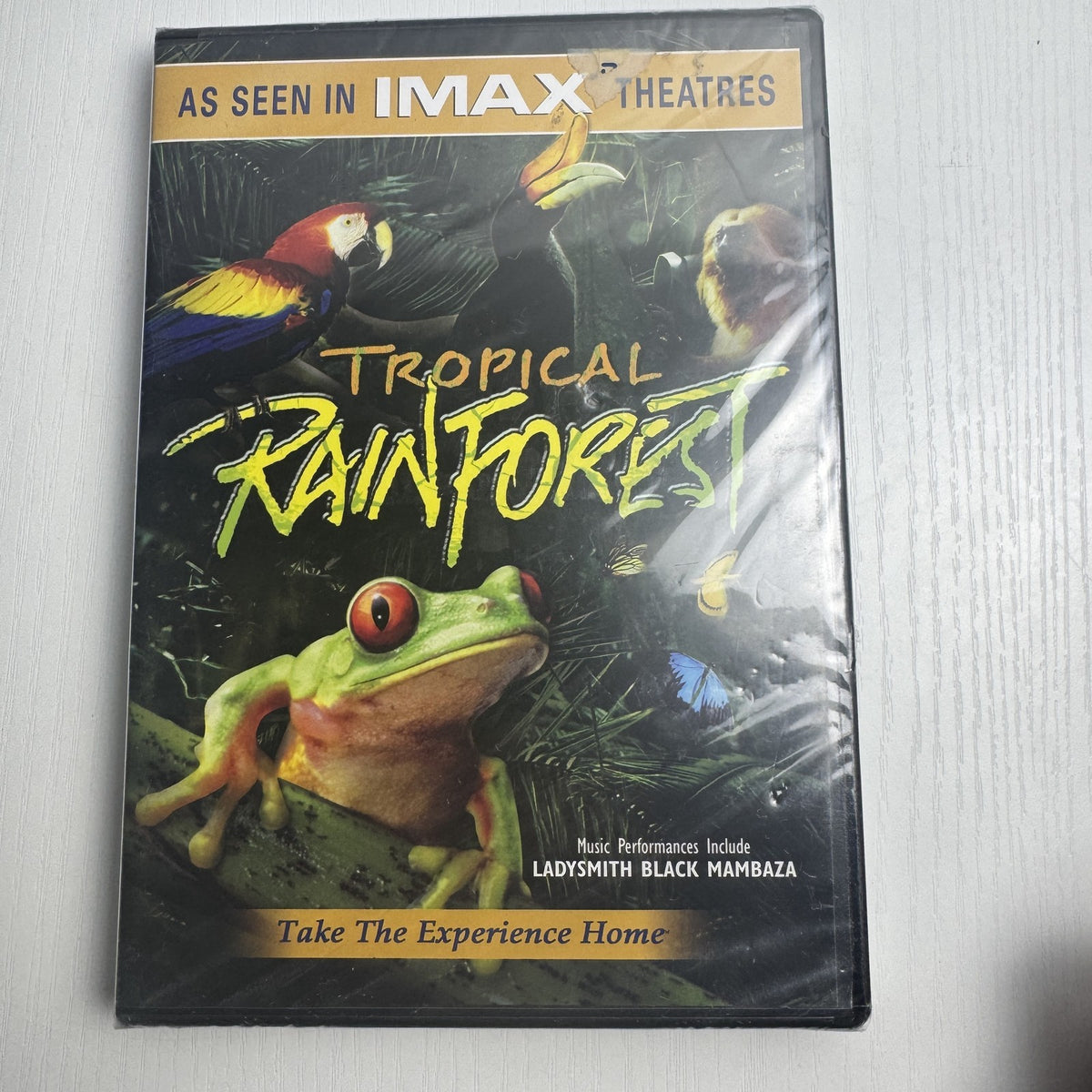 Brand new sealed 4-DVD lot including IMAX Tropical Rainforest, Nat Geo Islands, Yogi Berra, and Beijing Bicycle.