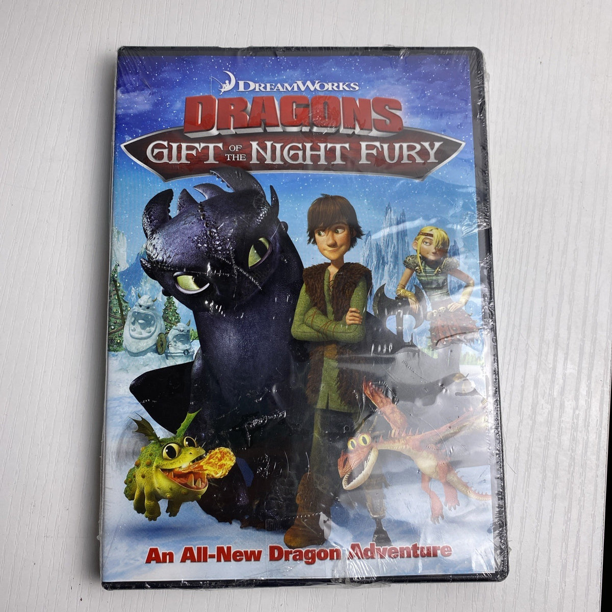 Set of 4 brand new factory sealed family DVDs including DreamWorks Dragons and Shirley Temple