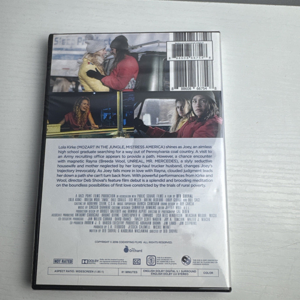 Four factory-sealed DVD movie cases including A Tale of Two Guns, American Teacher, AWOL, and A Piece of Eden.