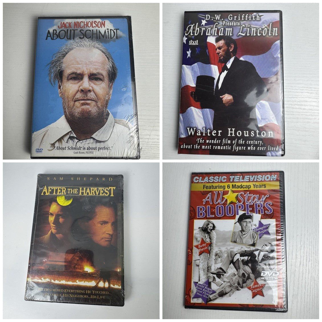 Set of four brand new factory sealed classic movie DVDs including About Schmidt and Abraham Lincoln.