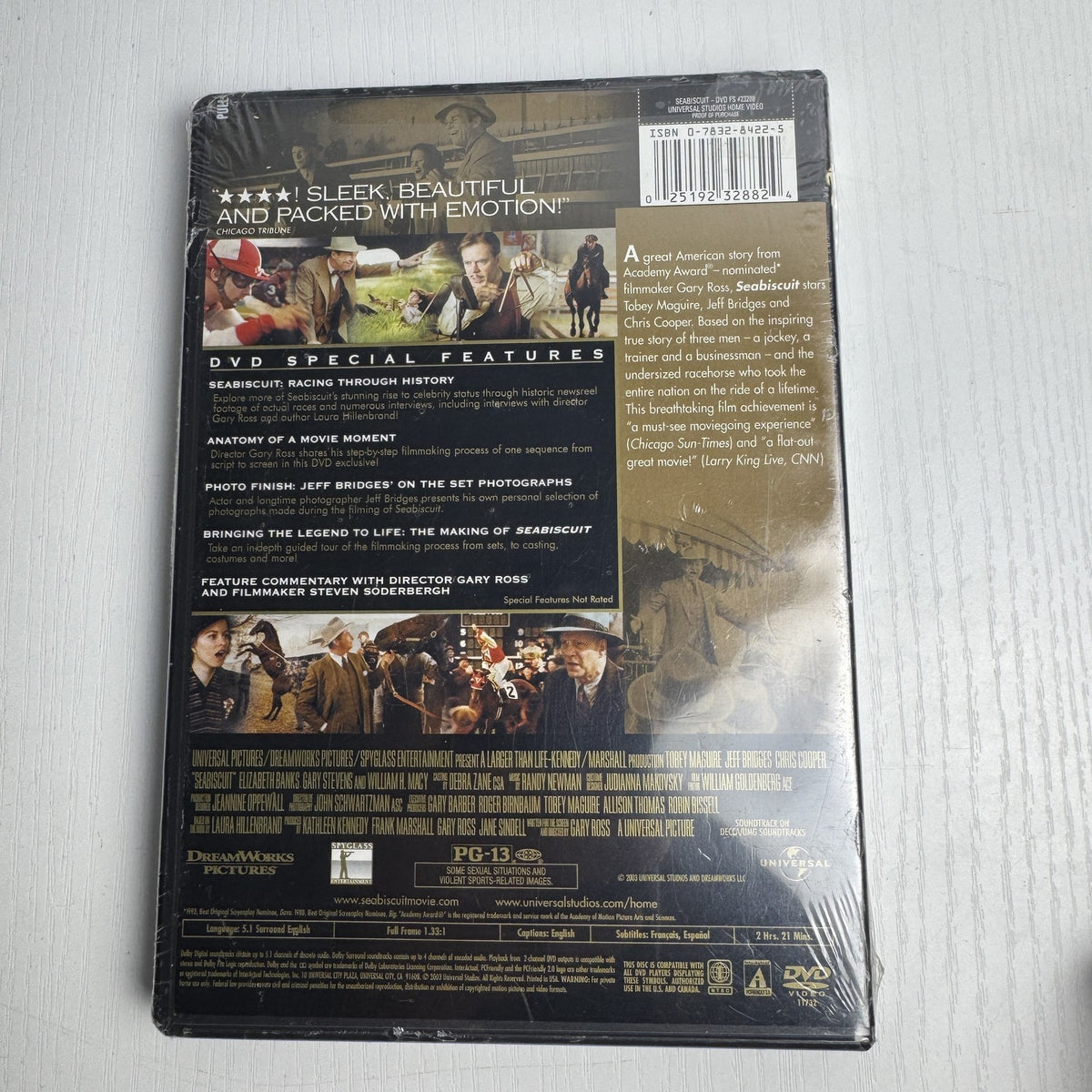 Set of 4 brand new factory sealed movie DVDs including Seabiscuit, Saint Ralph, Road, and Suze Orman.