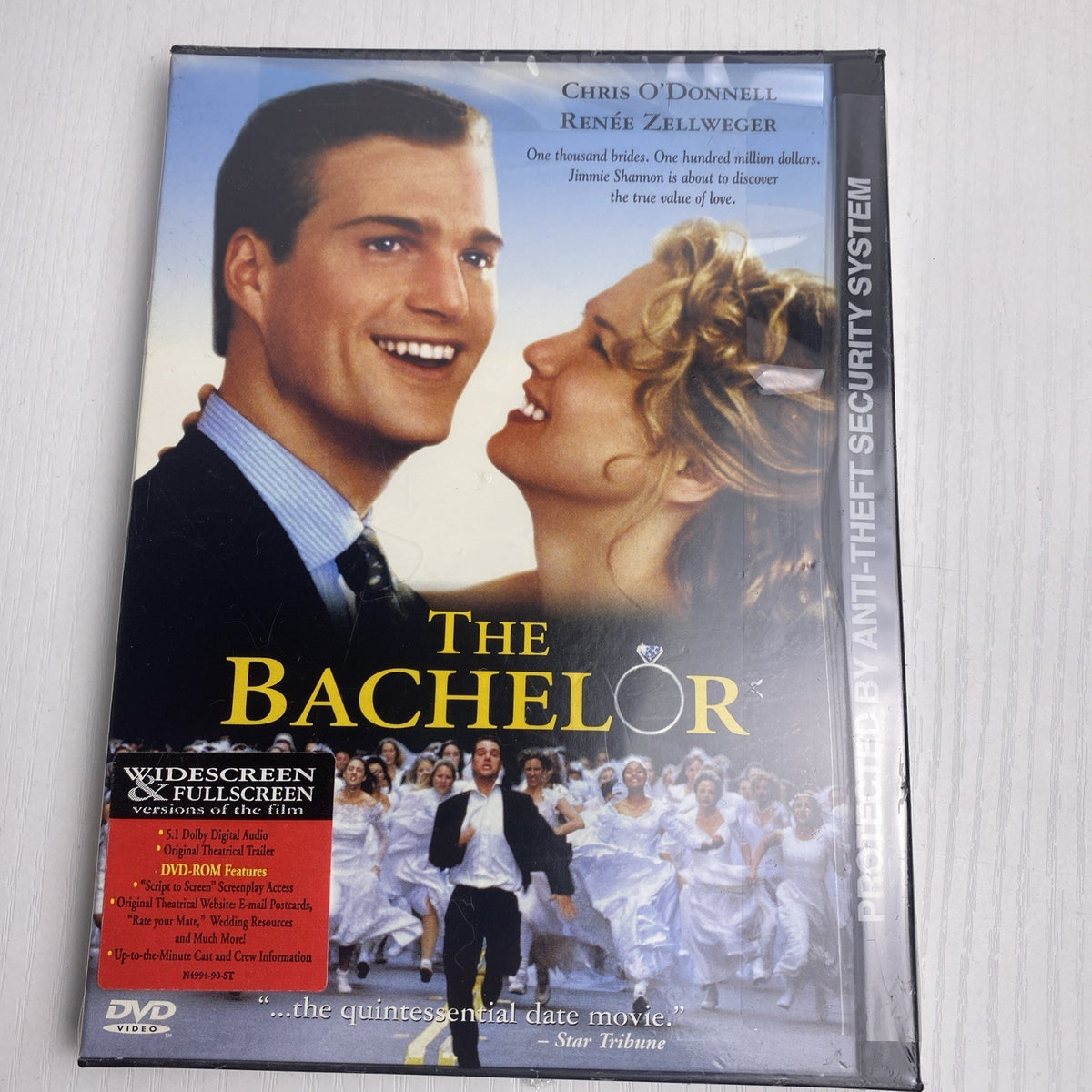 Brand new 3-DVD lot featuring factory-sealed copies of The Dark Knight, The Blind Side, and The Bachelor.