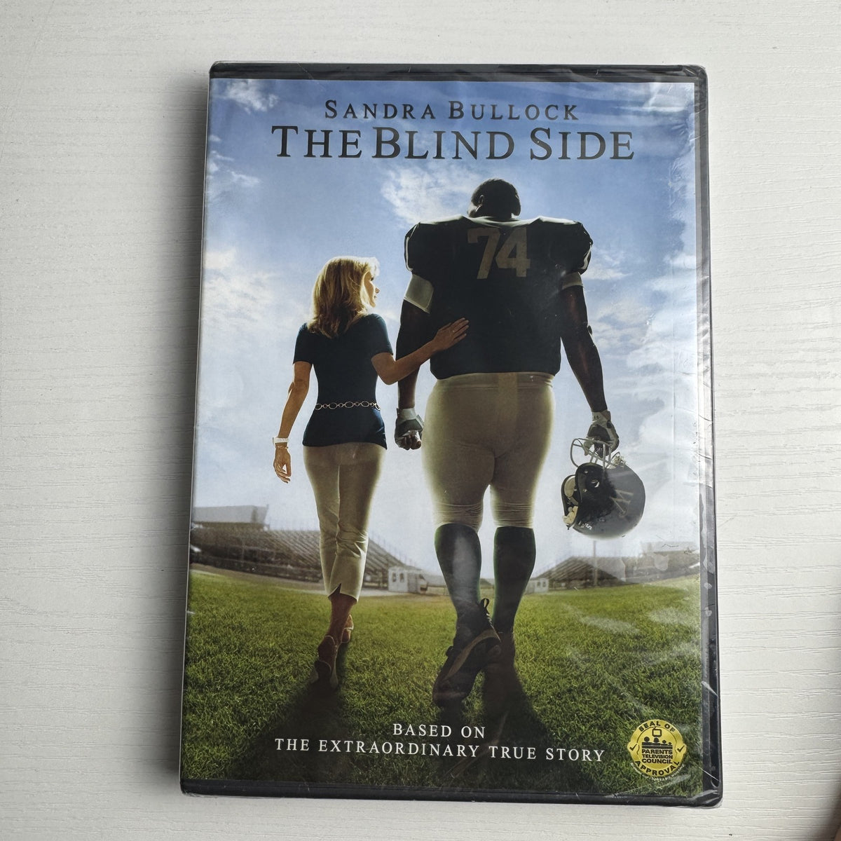 Brand new 3-DVD lot featuring factory-sealed copies of The Dark Knight, The Blind Side, and The Bachelor.