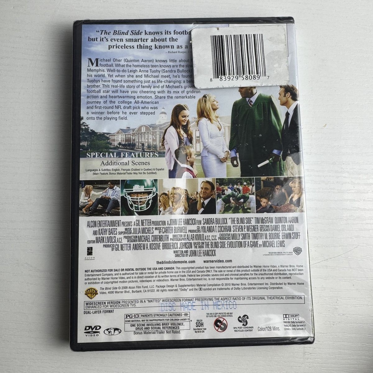 Brand new 3-DVD lot featuring factory-sealed copies of The Dark Knight, The Blind Side, and The Bachelor.