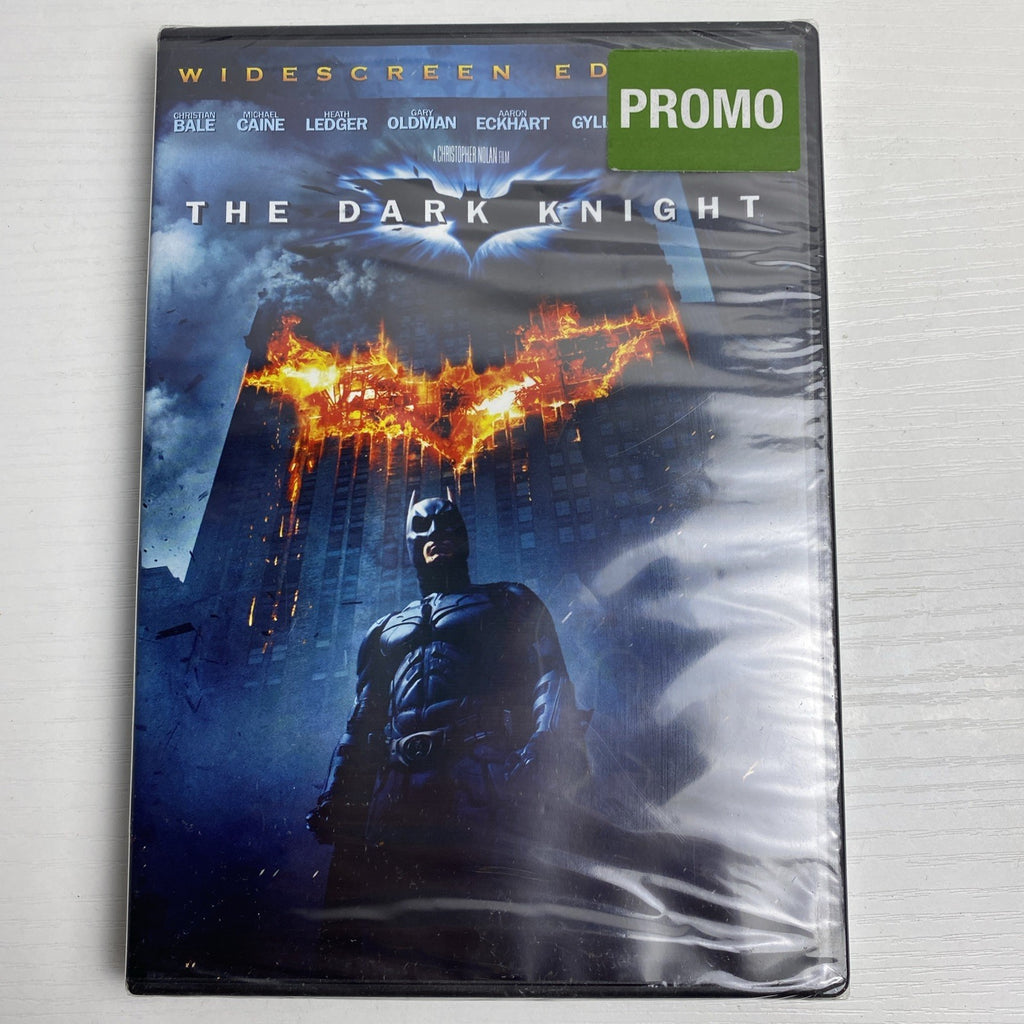 Brand new 3-DVD lot featuring factory-sealed copies of The Dark Knight, The Blind Side, and The Bachelor.