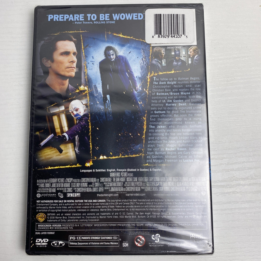 Brand new 3-DVD lot featuring factory-sealed copies of The Dark Knight, The Blind Side, and The Bachelor.