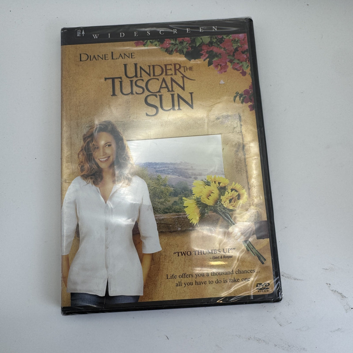 Lot of 4 brand-new factory-sealed DVDs featuring Under the Tuscan Sun, Vantage Point, and Charlie Chaplin.
