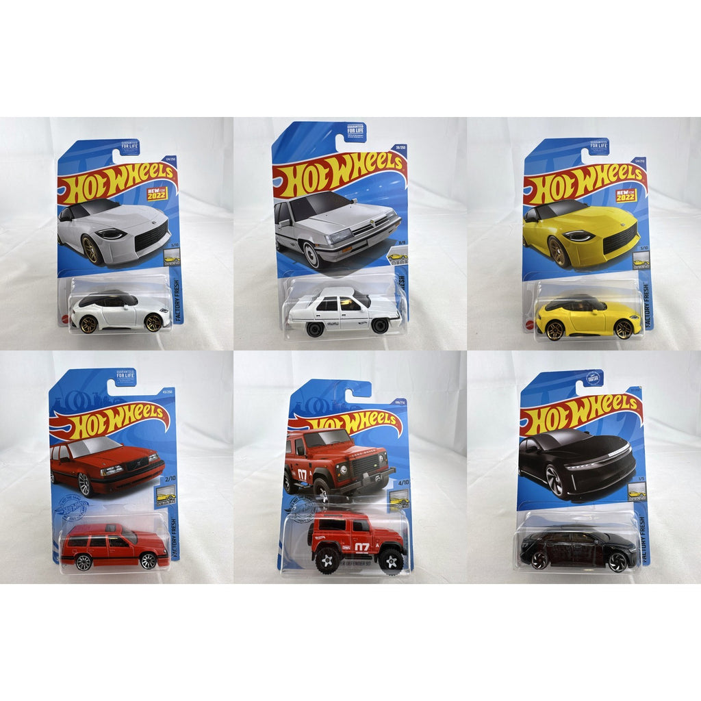 Hot Wheels Factory Fresh 1:64 6-car diecast lot including Nissan Z Proto, Volvo 850 Estate, Land Rover, and Lucid Air.